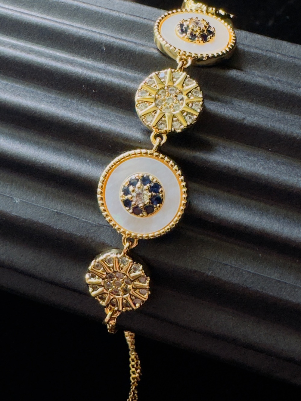 Gold and White Medallion Bracelet with Blue Accents